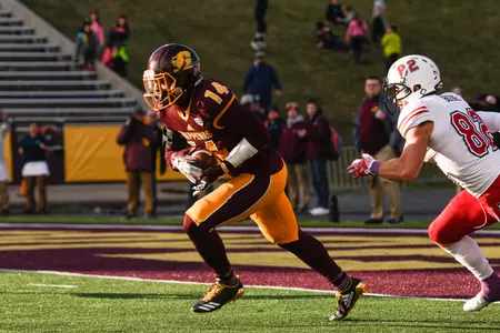 CMU senior safety Josh Cox (14) returns an interception late in last week's 31-24 victory over Northern Illinois at Kelly/Shorts Stadium. Cox has six interceptions on the season, the most by a Chippewa since 1988.