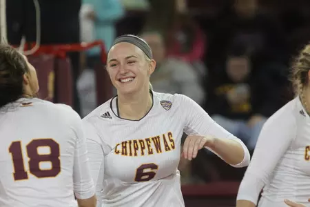Paige Carey (18) and Taylor Robertson, two of the four seniors on the CMU roster, celebrate a point on Saturday night in the Chippewas' 3-0 MAC victory over Western Michigan at McGuirk Arena.