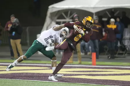 Corey Willis (8) hauls in a TD pass in the Chippewas' 42-30 victory over Eastern Michigan on Wednesday at Kelly/Shorts Stadium.