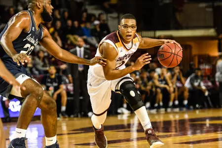 CMU guard Shawn Roundtree (right) drives past Jackson State's Darius Austin during the Chippewas' 70-63 victory on Friday at McGuirk Arena.