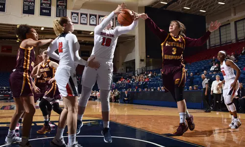 CMU junior guard Presley Hudson (3) battles Duquesne's Paige Cannon for a rebound on Sunday in the Chippewas' 64-61 nonconference loss.