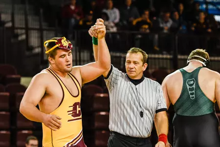 CMU's Matt Stencel (left), who is unranked, scored a 4-3 upset of 14th-ranked Shawn Streck of Purdue on Monday.
