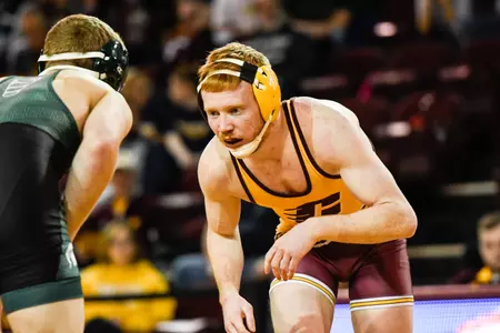 CMU junior Justin Oliver (right) will wrestle on Saturday morning for a spot in the championship match at 149 pounds at the Cliff Keen Las Vegas Invitational.