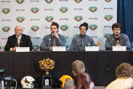 CMU coach John Bonamego along with players (from left) Tyler Conklin, Amari Coleman and Joe Ostman address the media on Wednesday at Albertsons Stadium in Boise, Idaho.