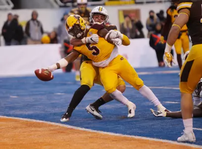 CMU sophomore running back Jonathan Ward (5) stretches the ball across the goal line for a touchdown in the Chippewas' loss to Wyoming on Friday in the Famous Idaho Potato Bowl.