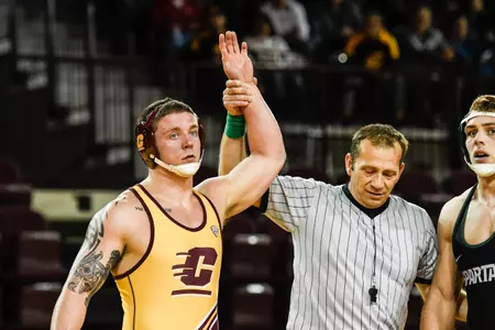 Jordan Ellingwood (left) is one of three CMU wrestlers who has reached the semifinals at the Midlands Championships.