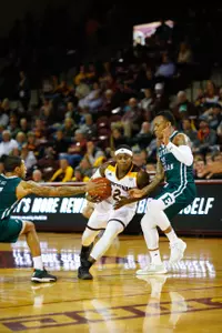 CMU senior Braylon Rayson (right) embraces assistant coach Kevin Gamble in the final moments of the Chippewas' home loss Tuesday to Eastern Michigan.