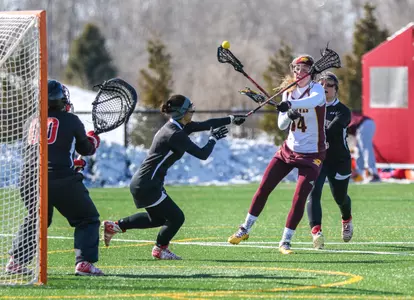 CMU's Anna Schoonover (14) eyes the cage Tuesday in the Chippewas' 18-6 win over Gardner-Webb.