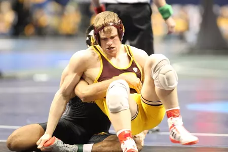 CMU's CJ Brucki battles top-seeded Zahid Valencia of Arizona State during a 174-pound match on Thursday at the NCAA Championships at Scottrade Center in St. Louis.