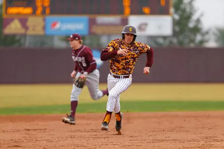 CMU senior Alex Borglin charges toward third base and eventually scores on a Jason Sullivan double during CMU's four-run second inning on Sunday at Theunissen Stadium.