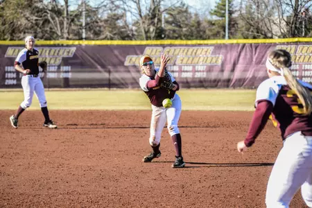 CMU second baseman Rachel Vieira (left) flips to first baseman Erika Underwood Tuesday during the Chippewas' 2-0 loss to Michigan at Margo Jonker Stadium.