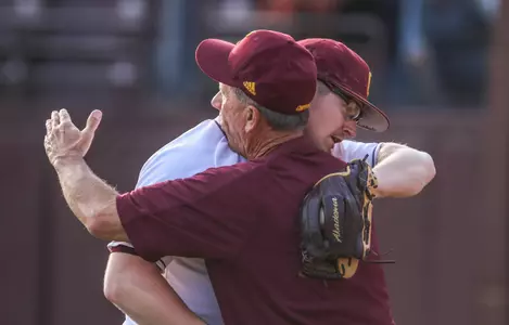 CMU pitcher Colton Bradley gets a hearty hug from coach Steve Jaksa after recording the save in CMU's 7-5 win over Western Michigan on Friday at Theunissen Stadium.