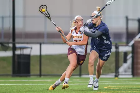 CMU's Riley Huda (left) ranks 11th in the nation with 37 assists.