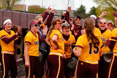 CMU players greet pitcher Rachael Knapp (15) after the Chippewas swept Ball State on Saturday at Margo Jonker Stadium.