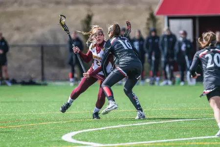 Natalie Karlen (left) scored three goals to lead CMU on Friday in its 20-8 loss at Stetson.