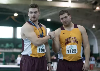 CMU's Dylan Banagis (left) and Logan Targgart are ranked third and first, respectively, in the men's hammer throw at the MAC Championships.
