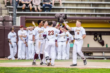 Daniel Jipping (16) is greeted at home plate by his teammates after his fourth-inning two-run home run on Thursday at Theunissen Stadium.