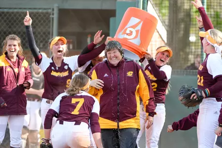 Longtime CMU coach Margo Jonker is doused with water by her players after the Chippewas claimed the regular-season MAC championship on Sunday at Eastern Michigan.