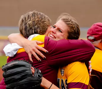CMU senior pitcher Rachael Knapp hugs coach Margo Jonker during the Chippewas' Senior Day ceremony.