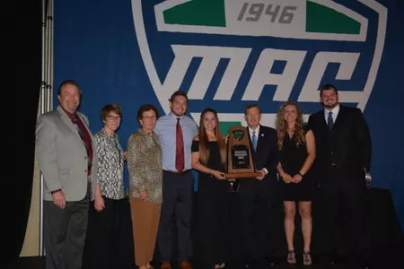Members of the Central Michigan contingent at the MAC Honors Dinner on Wednesday accept the league Institutional Sportsmanship Award from MAC Commissioner, Dr. Jon A. Stienbrecher (center). Representing CMU are (from left) Faculty Athletics Representative Kevin Love, Deputy Athletic Director Cristy Freese, Interim Athletics Director Marcy Weston, student-athletes Dylan Banagis and Christen Chiesa, Steinbrecher, and student-athletes Evelyn Lorimer and Derek Edwards.