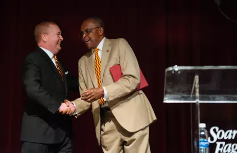 CMU President Dr. George E. Ross (right) welcomes new athletic director Michael Alford on Friday during the annual Chippewa Challenge at the Soaring Eagle Casino.
