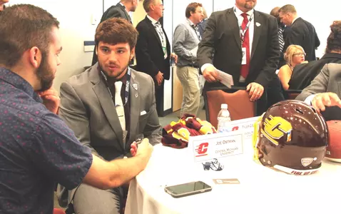 CMU senior defensive end Joe Ostman talks with a reporter on Wednesday during MAC Media Day at the Pro Football Hall of Fame in Canton, Ohio.