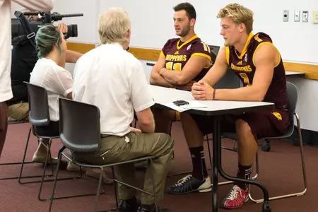 Quarterback candidates Shane Morris (11) and Tony Poljan talk with members of the media on Sunday during the Chippewas' annual media day.