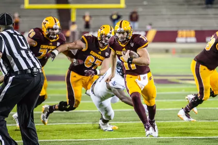 CMU quarterback Shane Morris runs to daylight on Thursday in the Chippewas' 30-27 triple-overtime season-opening win over Rhode Island at Kelly/Shorts Stadium.
