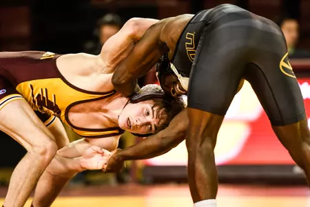 CMU freshman Drew Hildebrandt (left) tangles with Missouri's Barlow McGhee on Friday during a Mid-American Conference dual meet at McGuirk Arena. Hildebrandt, a redshirt freshman, posted a 5-4 victory.