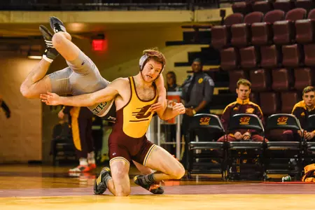 CMU's Colin Heffernan battles Eastern's J.J. Wolfe in the 157-pound match on Friday at McGuirk Arena. Heffernan posted a 14-9 victory as the Chippewas downed the Eagles, 27-9.