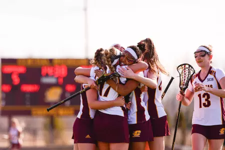 CMU players celebrate a goal on Wednesday during their 19-9 win over Butler at the CMU Lacrosse Complex.
