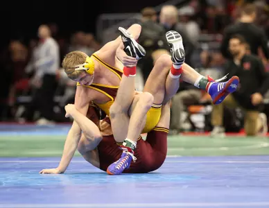 Central Michigan's Mason Smith battles Minnesota's Thomas Thorn in a 141-pound bout on Thursday at the NCAA Championships at Quicken Loans Arena in Cleveland. Smith won, 3-0.