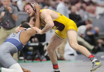CMU senior Colin Heffernan (right) battles Old Dominion's Larry Early in a 157-pound consolation-bracket match on Thursday during the NCAA Championships at Quicken Loans Arena in Cleveland.