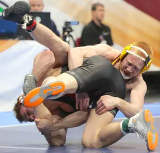 CMU's Justin Oliver battles Boo Lewallen during a 149-pound elimination match on Friday at Quicken Loans Arena in Cleveland.