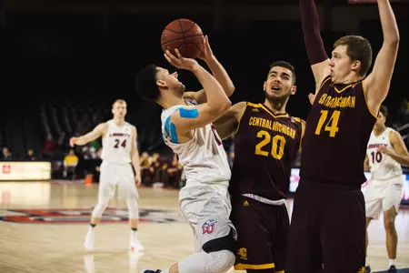 CMU's Kevin McKay (20) and David DiLeo defend on Saturday in the Chippewas loss at Liberty in a CIT quarterfinal game.