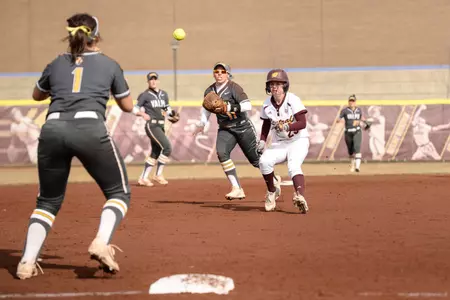 CMU's Allison Curtis (right) finds herself in a rundown between second base and third on Wednesday in CMU's 8-3 victory over Valparaiso at Margo Jonker Stadium.