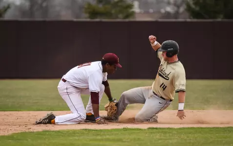 CMU shortstop Zavier Warren puts the tag on Oakland's Ben Hart on Tuesday during CMU's 8-4 nonconference win at Keilitz Field at Theunissen Stadium.