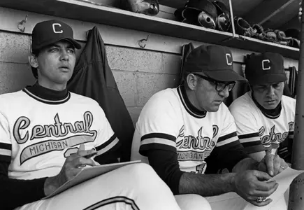 Dave Keilitz (left) sits alongside his longtime assistant and pitching coach Dean Kreiner in the Chippewa dugout. Keilitz's No. 34 and Kreiner's No. 33 will be retired during a ceremony on Saturday prior to the Chippewas' baseball game with Kent State at Theunissen Stadium.
