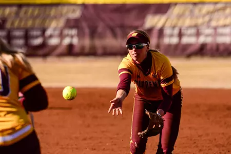 CMU second baseman Rachel Vieira makes the underhand toss to first during a victory over Miami (Ohio) last weekend at Margo Jonker Stadium. The Chippewas rank fifth in the MAC in defense with a .961 fielding percentage, and have turned a MAC-best 12 double plays on the season.