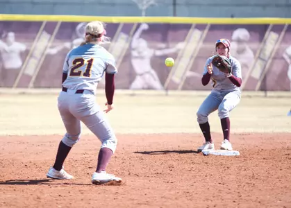 CMU shortstop Morgan Gardner (21) makes a toss to second baseman Rachel Vieira on Sunday during the Chippewas' doubleheader sweep of Buffalo at Margo Jonker Stadium.