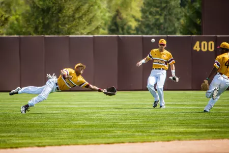 CMU left fielder David Cole makes a diving attempt for a fly ball on Friday in the Chippewas' 5-3 win over Ohio at Keilitz Field at Theunissen Stadium.
