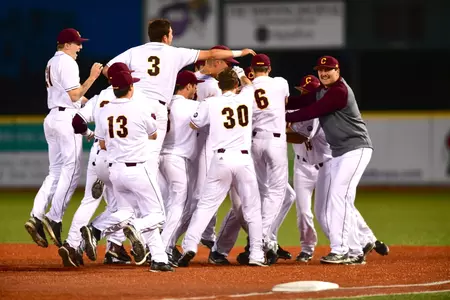CMU player mob Blake Cleveland after Cleveland's bunt in the bottom of the ninth inning brought home the winning run in the Chippewas' 7-6 come-from-behind victory over Toledo in a Mid-American Conference Tournament game.