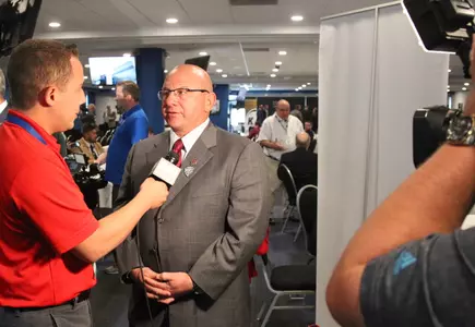 CMU football coach John Bonamego talks with a reporter on Tuesday during MAC Media Day at Ford Field in Detroit.