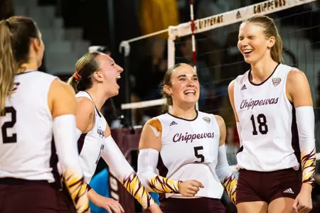 Volleyball team celebrates post sweep over Akron