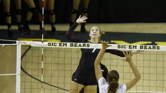 Maddie Hills (7) goes up for a kill