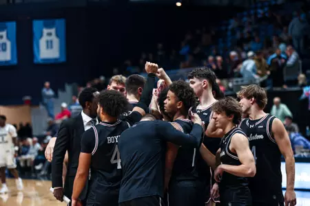 Men's Basketball Team Huddle