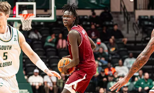 Chol Machot holds the basketball