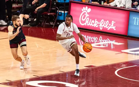Jaxon Prunty dribbles the ball up the court