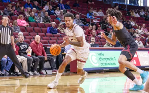 Martin Kalu dribble sthe basketball