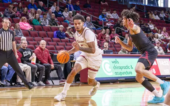 Martin Kalu dribble sthe basketball